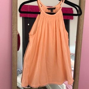 This is a peach colored tank top